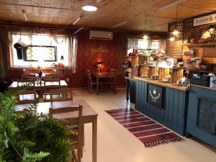 view of a cozy cafe, tables and counter