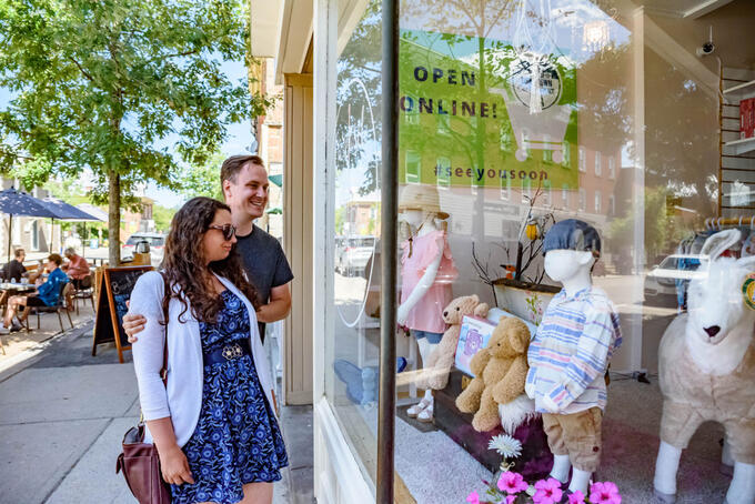 author and partner looking in shop window