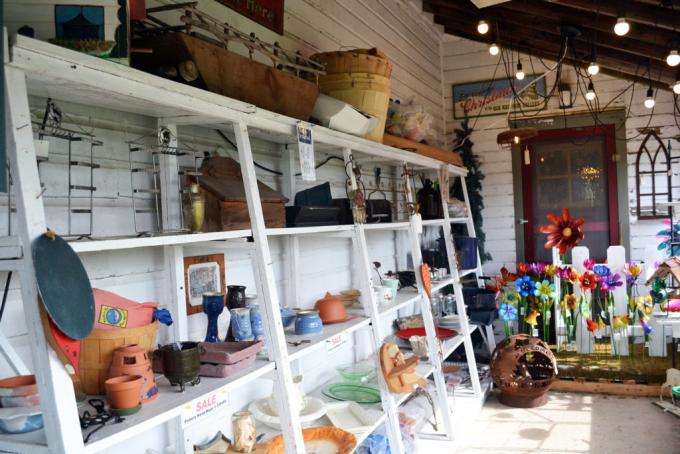 white wooden shelves full of pottery, crafts, ornaments and gifts at The Old Hastings Gallery